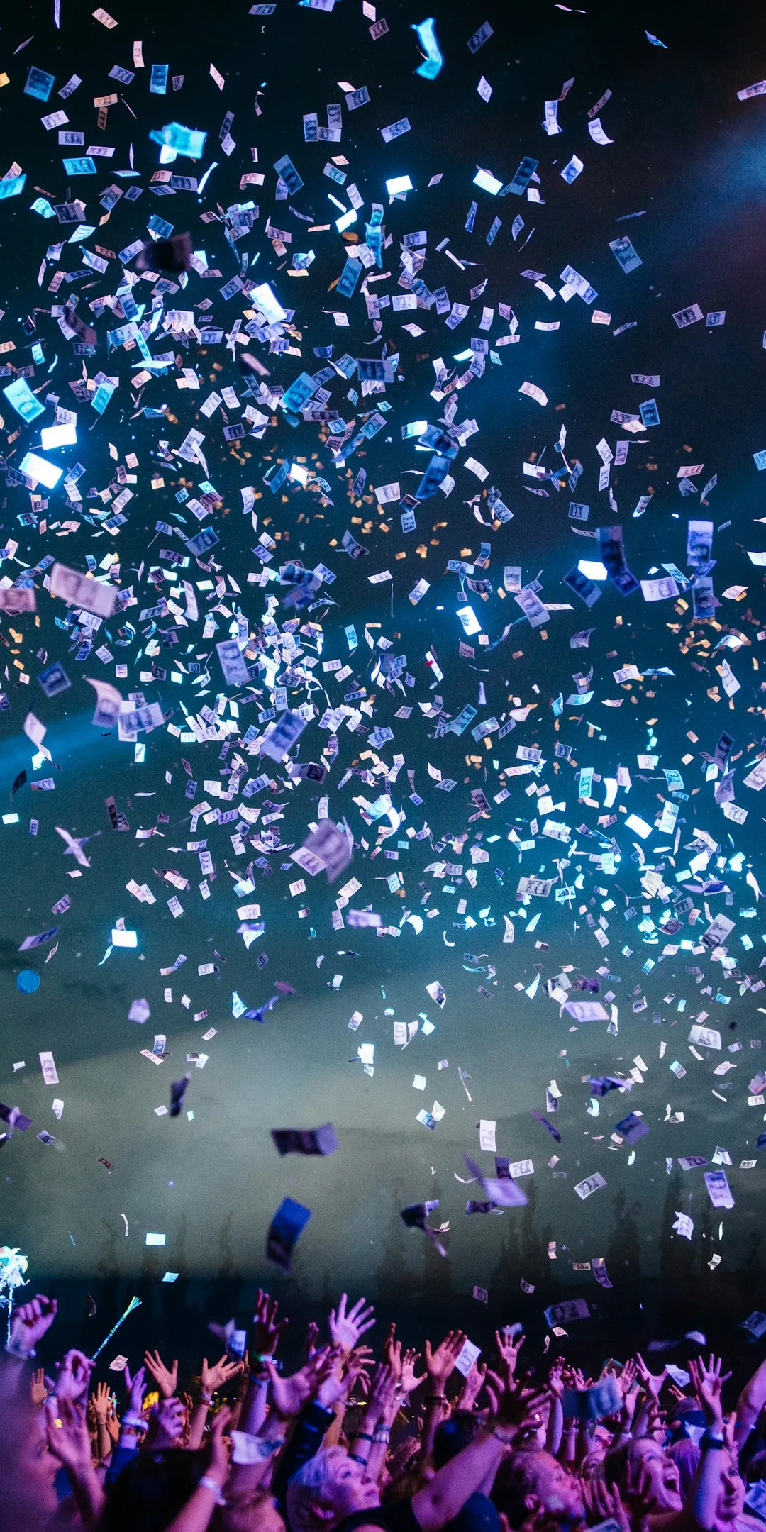 Confetti falling over a cheering stadium crowd